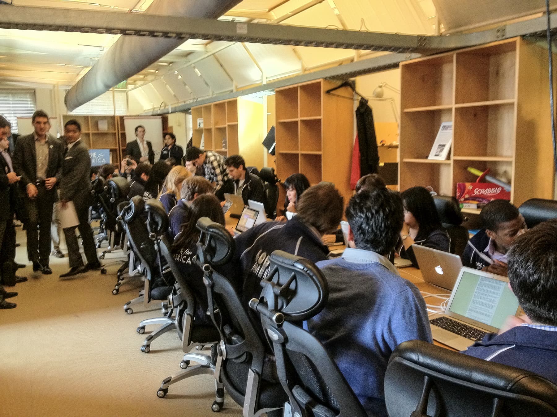 People working around laptops at a technology workshop