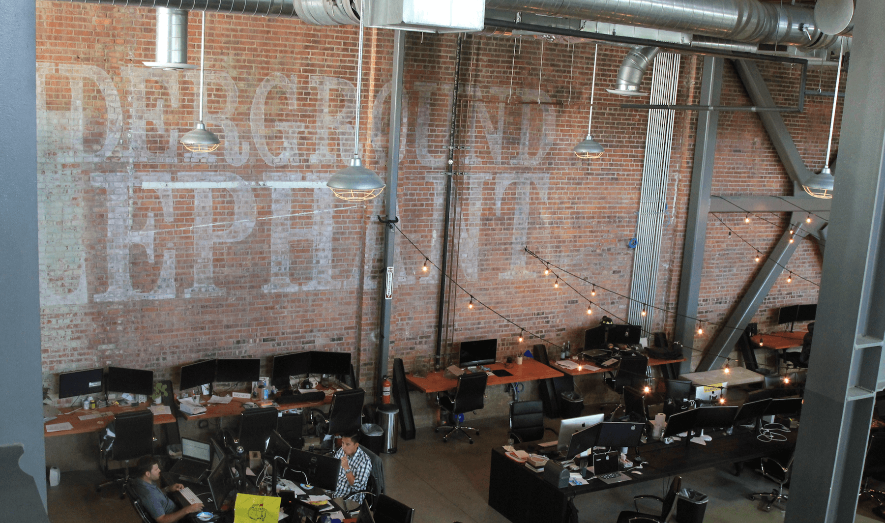 A startup office workspace with desks and computers